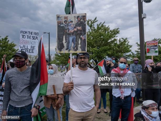 Hundreds of residents of Dearborn, Michigan gather outside of the Dearborn police department on May 15, 2021 to protest the actions of the Israeli...