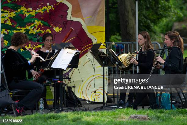 New York Philharmonic musicians perform during the "Bandwagon 2" concert series in Harlem, New York on May 15 2021. - One of America's oldest musical...