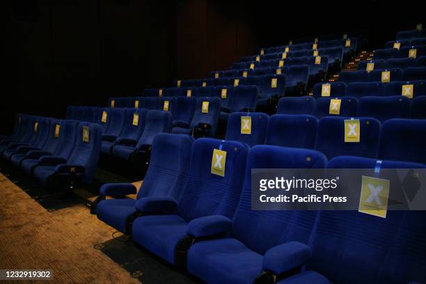 Empty seats inside the theater with a cross symbol to indicate that the audience should keep their distance at the XXI Cinema, Kuningan area on the...