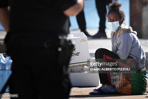 Young migrant, with a group of some under 15 years old of various nationalities, assisted by NGO Save The Children Italia, waits to board a ferry to...