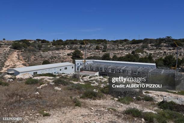 General view shows the so-called migrant "Hotspot" operational processing facility on the southern Italian Pelagie Island of Lampedusa on May 16,...