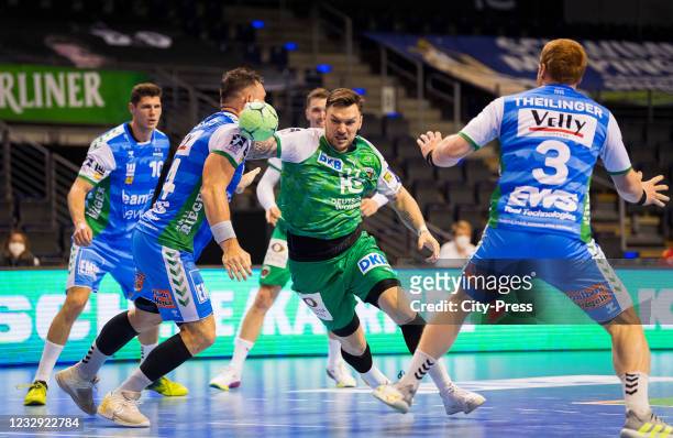 Jacob Bagersted of Frisch Auf Goeppingen, Johan Koch of the Fuechse Berlin and Nicolai Theilinger of Frisch Auf Goeppingen during the game between...