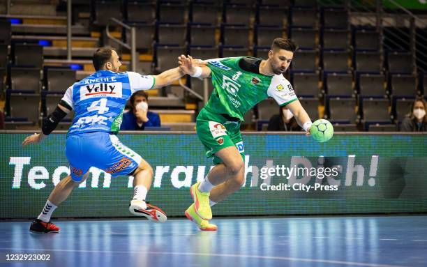 Tim Kneule of Frisch Auf Goeppingen and Fabian Wiede of the Fuechse Berlin during the game between the Fuechse Berlin and FRISCH AUF! Goeppingen at...