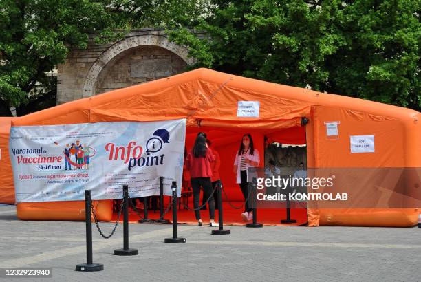 Woman goes into the tent to get vaccinated. These days the Romanian health authorities have proposed the Vaccination Marathon to vaccinate the...
