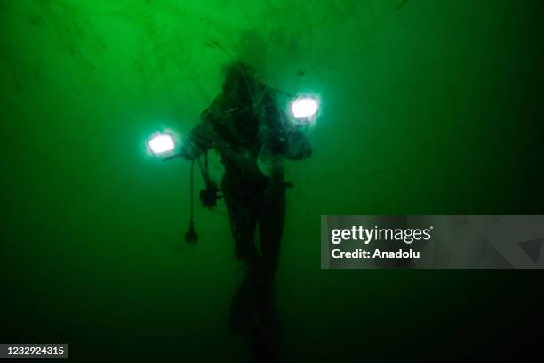 Diver is seen with sea saliva as mucilage continues to be effective under water and to be threat for sea creatures in Sea of Marmara, Istanbul,...