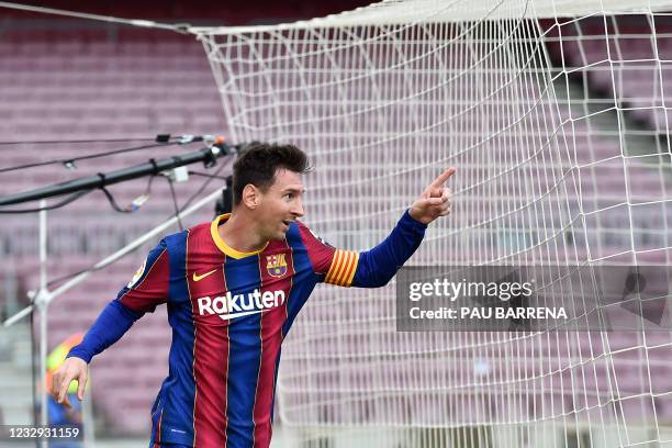 Barcelona's Argentine forward Lionel Messi celebrates a goal during the Spanish League football match between FC Barcelona ans RC Celta de Vigo at...