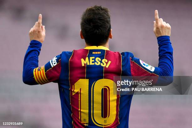 Barcelona's Argentine forward Lionel Messi celebrates after scoring a goal during the Spanish League football match between FC Barcelona and RC Celta...
