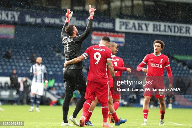 Goalkeeper Alisson Becker of Liverpool celebrates after scoring a goal to make it 1-2 during the Premier League match between West Bromwich Albion...