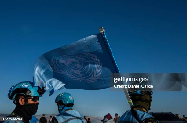 United Nations peacekeeping force in Lebanon soldiers monitor a demonstration to show solidarity with Palestinians as near the Lebanon-Israel border...