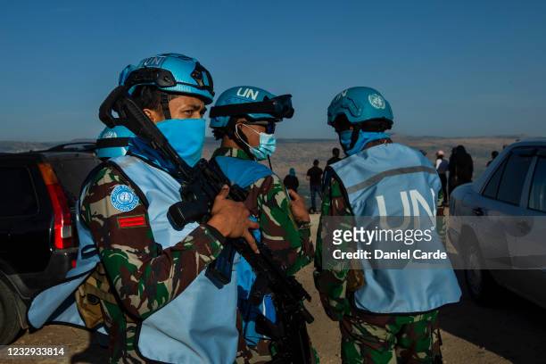 United Nations peacekeeping force in Lebanon soldiers monitor a demonstration to show solidarity with Palestinians as near the Lebanon-Israel border...