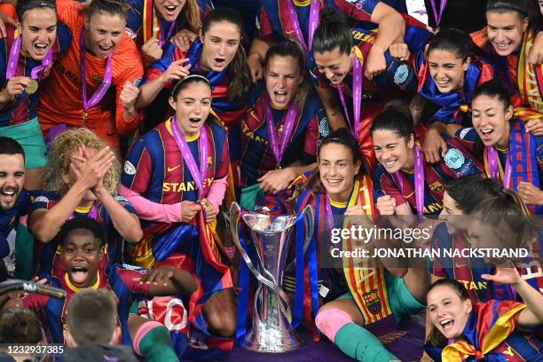 Barcelona's team poses for a picture with their trophy after winning the UEFA Women's Champions League final between Chelsea FC and FC Barcelona in...