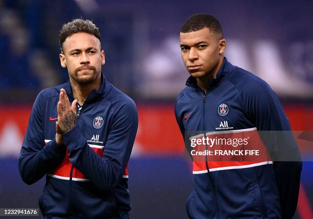 Paris Saint-Germain's French forward Kylian Mbappe and Paris Saint-Germain's Brazilian forward Neymar look on during the French L1 football match...