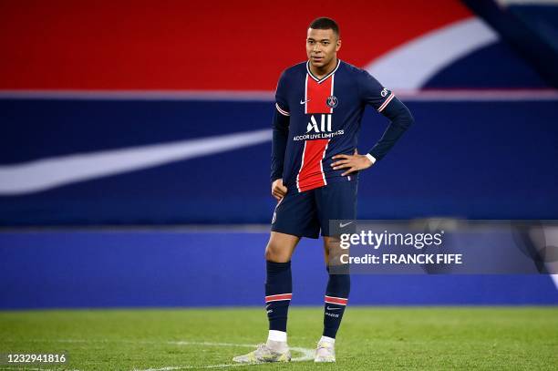 Paris Saint-Germain's French forward Kylian Mbappe looks on during the French L1 football match between Paris Saint-Germain and Stade de Reims at the...