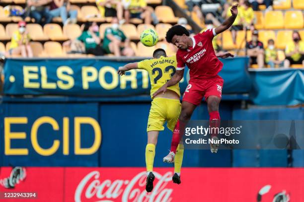 Villarreal's Moises Gomez Bordonado jumps for the ball with Jules Kounde of Sevilla FC during spanish La Liga match between Villarreal cf and Sevilla...