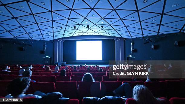 Cinema-goers watch Ingmar Bergman's "Persona" in the BFI Southbank cinema in London on May 17 as Covid-19 lockdown restrictions ease.