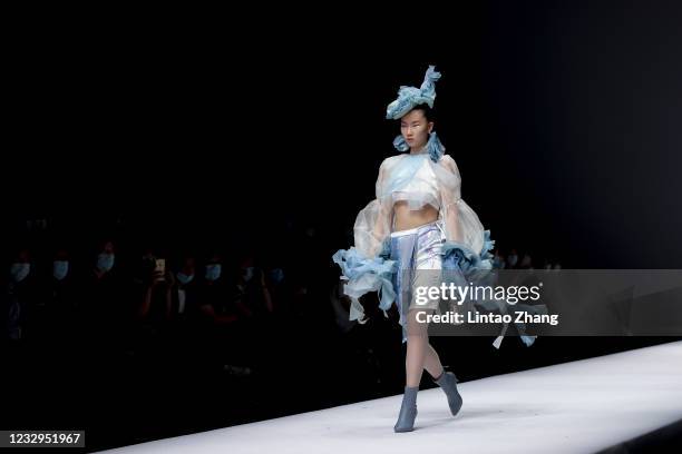 Model showcases designs on the runway at the School Arts Soochow University collection show on day three of 2021 China Graduate Fashion Week at...