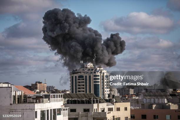 Smoke rises following an Israeli air strike on a building on May 17, 2021 in Gaza City, Gaza. More than 200 people in Gaza and ten people in Israel...