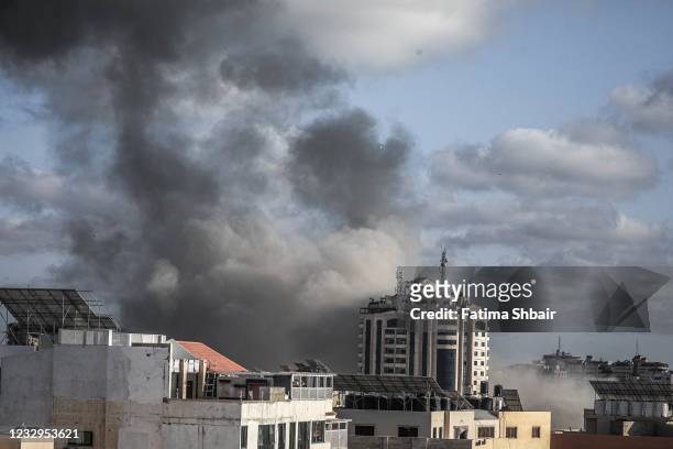 Smoke rises following an Israeli air strike on a building on May 17, 2021 in Gaza City, Gaza. More than 200 people in Gaza and ten people in Israel...