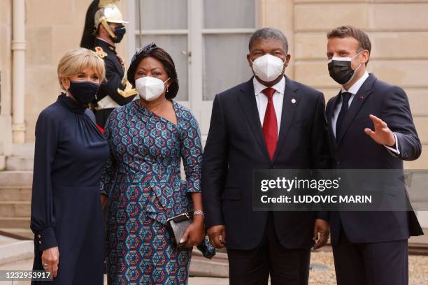 France's President Emmanuel Macron and his wife Brigitte Macron , welcome Angola's President Joao Lourenco and his wife Ana Dias Lourenco upon their...