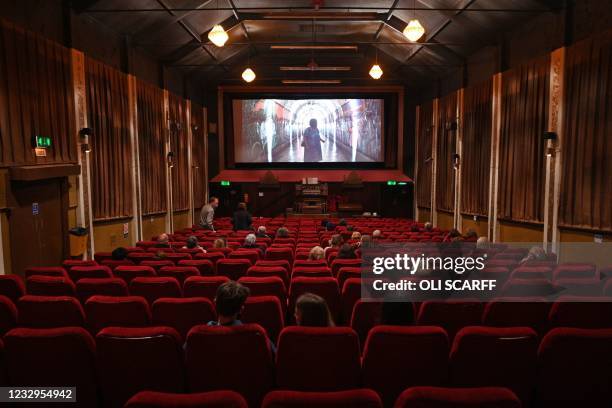 Cinema-goers take their seats for a showing of "Nomadland" in the Rex cinema in Elland in northern England on May 17 as Covid-19 lockdown...