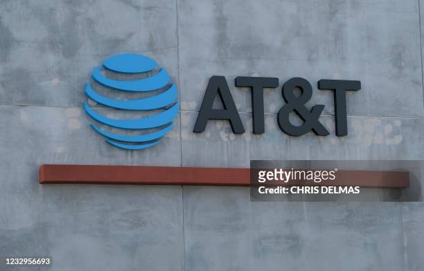The AT&T logo sign is seen above the store in Culver City, California on January 28, 2021. - US telecommunications firm AT&T announced on May 17,...