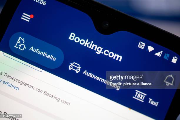 May 2021, Berlin: The app of the travel portal Booking.com is shown on a smartphone. The Cartel Senate of the Federal Court of Justice will take a...