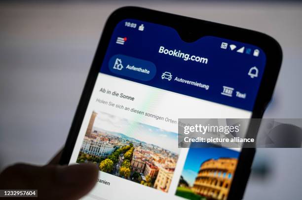 May 2021, Berlin: The app of the travel portal Booking.com is shown on a smartphone. The Cartel Senate of the Federal Court of Justice will take a...