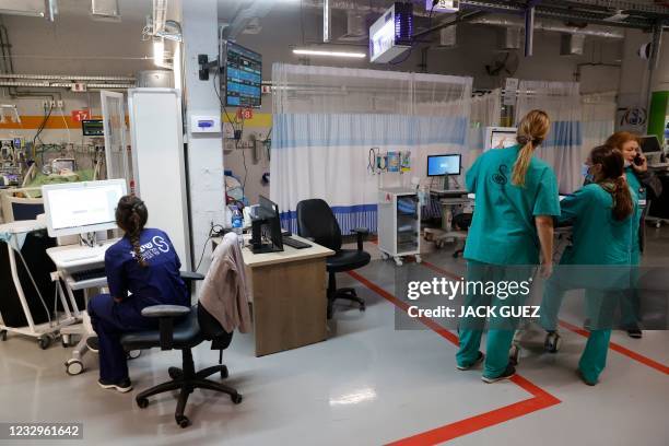 Medics work at the neonatal intensive care unit after the department was moved to an underground parking of the Sheba medical center in the Israeli...