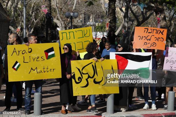 Arab Israelis protest against Israel's occupation of Palestinian territories and its air campaign on the Gaza strip, in Jaffa, near the coastal...