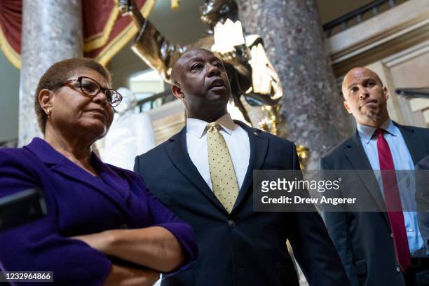 Rep. Karen Bass , Sen. Tim Scott , and Sen. Cory Booker speak briefly to reporters as they exit the office of Rep. James Clyburn following a meeting...