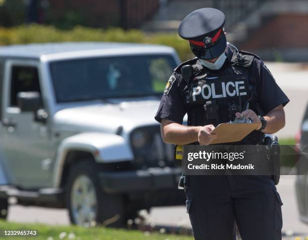 Police canvass the neighbourhood for any information. A family home in Vaughan is becoming a memorial to the two children struck and killed by a car...