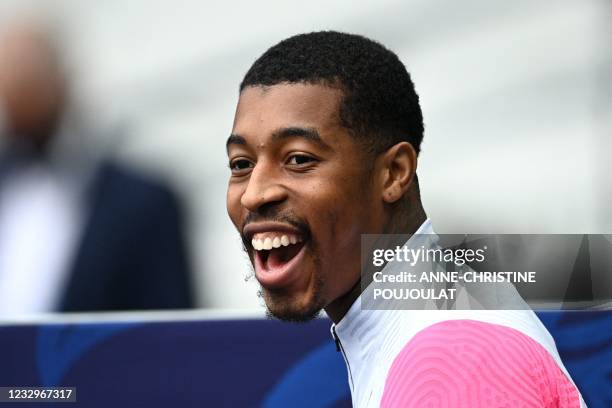 Paris Saint-Germain's French defender Presnel Kimpembe enters the pitch prior to a training session at the Stade de France stadium, in Saint-Denis,...