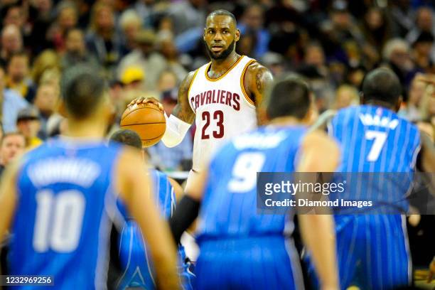 LeBron James of the Cleveland Cavaliers drives down the court in the first half of a game against the Orlando Magic at Quicken Loans Arena on October...