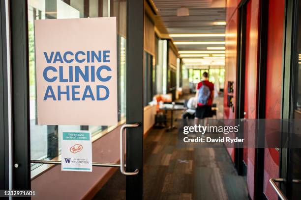 Sign directs patients at a COVID-19 vaccination clinic on the University of Washington campus on May 18, 2021 in Seattle, Washington. The two-day...