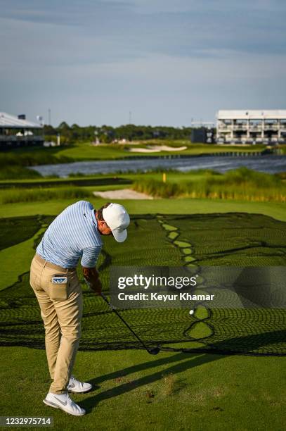Cameron Champ hits a 3-hybrid shot into the water from the back tee on the 17th hole during practice for the PGA Championship on The Ocean Course at...