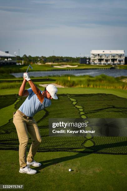 Cameron Champ hits a 4-iron shot into the water from the back tee on the 17th hole during practice for the PGA Championship on The Ocean Course at...