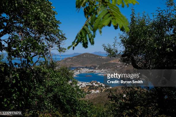 View of the main port area known as the Skala village of the Greek island of Patmos on May 17, 2021 in Patmos, Greece. Restrictive travel rules due...