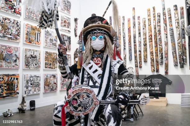 Multi-media, conceptual, visual and performance artist Kwok Mang Ho, also known as Frog King, poses for a photograph at the first preview day of Art...