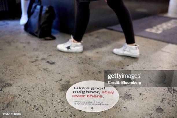 Social distancing sign at Barry's Bootcamp in the Upper East Side neighborhood of New York, U.S., on Wednesday May 12, 2021. New York is loosening...