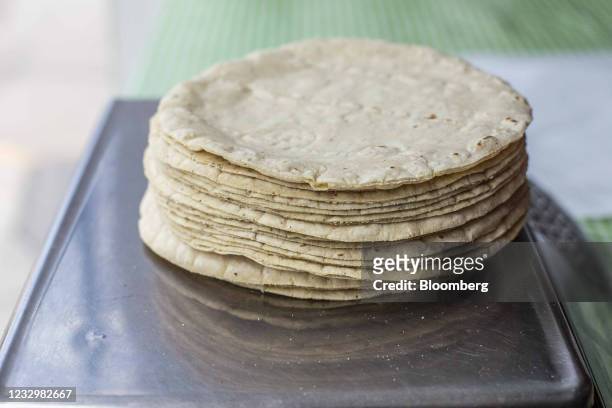 Corn tortillas are weighed on a scale at a facility in San Andres Cholula, Puebla state, Mexico, on Tuesday, May 18, 2021. In Mexico, higher corn...