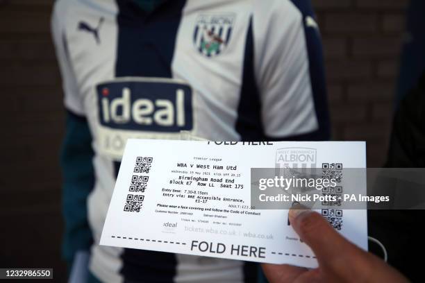 Match ticket is inspected as fans arrive at the stadium ahead of the Premier League match at The Hawthorns, West Bromwich. Picture date: Wednesday...