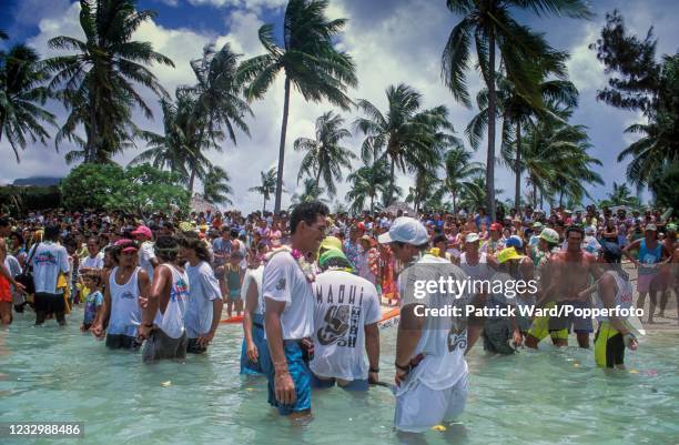 Festivities on Matira Beach at the climax of a 120-kilometre inter-island canoe race on the island of Bora Bora, French Polynesia, circa October 1991.