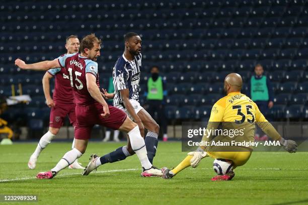 Craig Dawson of West Ham United watches on as Darren Randolph of West Ham United makes a point blank save from Semi Ajayi of West Bromwich Albion...