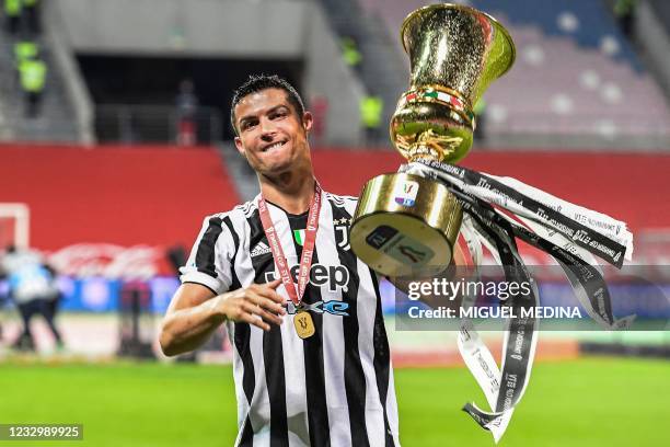 Juventus' Portuguese forward Cristiano Ronaldo holds the cup after Juevntus won the final of the Italian Cup football match Atalanta vs Juventus on...