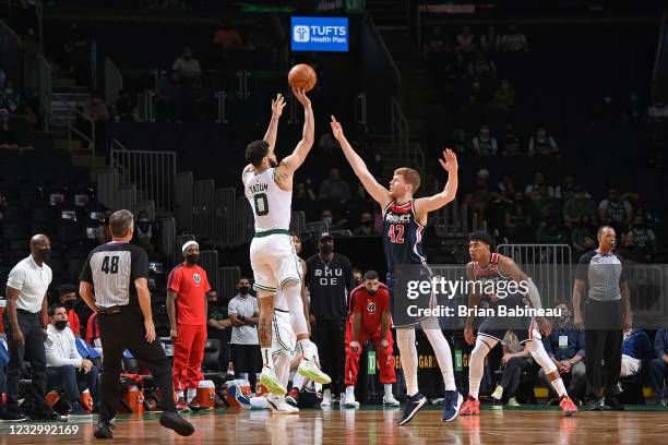 Jayson Tatum of the Boston Celtics shoots a three point basket against the Washington Wizards during the 2021 NBA Play-In Tournament on May 18, 2021...