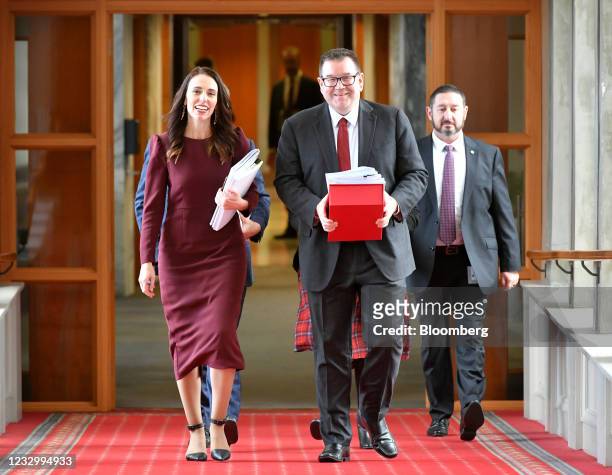 Jacinda Ardern, New Zealand's prime minster, left, and Grant Robertson, finance minister, center, arrive for the presentation of the budget at...