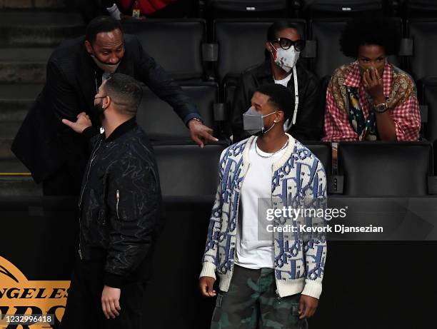 Sports commentator Stephen A. Smith interacts with rapper and musician Drake and actor Michael B Jordan during the NBA Play-In Tournament game...