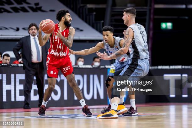 Dennis Jerome Seeley of FC Bayern Basketsball, Trae Bell-Haynes of HAKRO Merlin Crailsheim and Bogdan Radosavljevic of HAKRO Merlin Crailsheim battle...