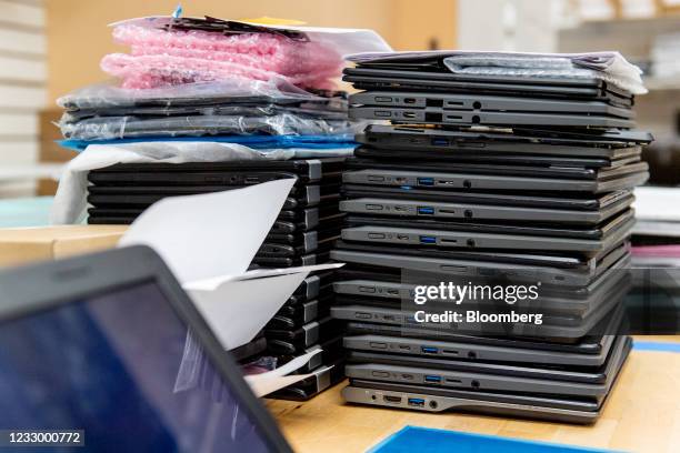 Stack of broken Chromebook laptops at Cell Mechanic Inc. Electronics repair shop in Westbury, New York, U.S., on Wednesday, May 19, 2021. For years,...