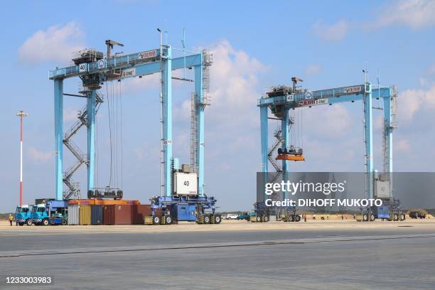 Photograph taken on May 20, 2021 shows cranes set at the Lamu Port, in Lamu, in Kenya on the inauguration day of the first berth of the harbour.